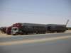 backontheroadonasphaltroadsinsudanverylongtrucksareused_small.jpg