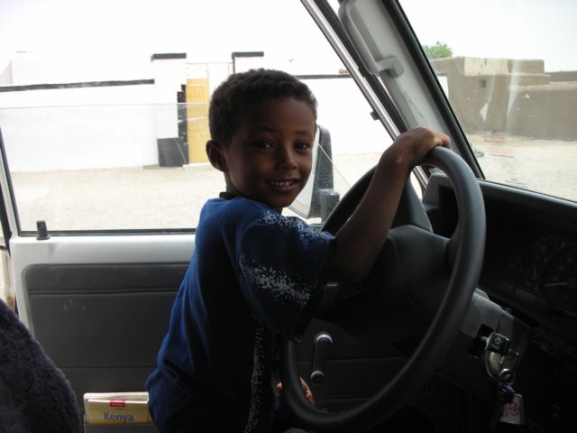 sudaneseboywantingtodriveourcar.jpg